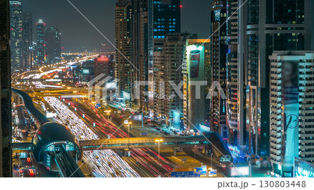 Downtown Dubai towers night timelapse. Aerial view of Sheikh Zayed road with skyscrapers. 130803448