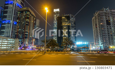 Downtown Dubai towers night timelapse hyperlapse. View of Sheikh Zayed road with tall skyscrapers. 130803471