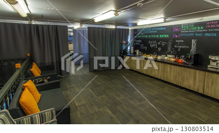 Creative work space in warm light timelapse hyperlapse, meeting room at modern office with kitchen area 130803514