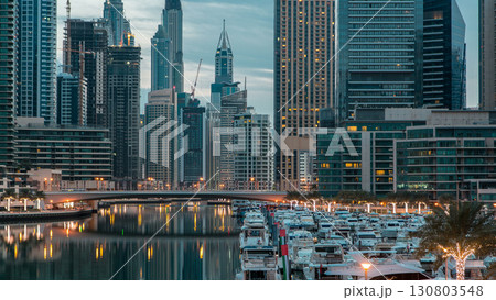 Dubai Marina towers and canal in Dubai night to day timelapse 130803548