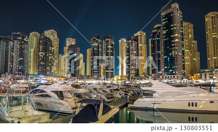Dubai Marina towers and yachts in Dubai at night timelapse hyperlapse 130803551