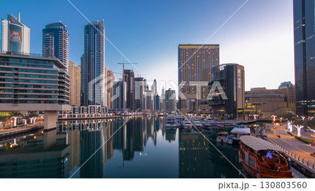 Dubai Marina towers and canal in Dubai night to day timelapse 130803560