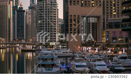 Dubai Marina towers and canal in Dubai night to day timelapse 130803562