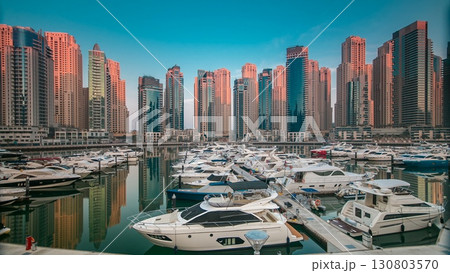 Dubai Marina at early morning hour timelapse with yachts 130803570