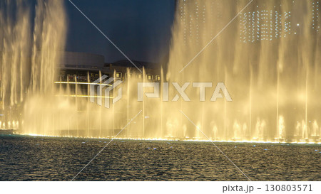 The Dancing Fountain of Dubai and lake day to night timelapse at dusk in Dubai, UAE. The Dancing Fountain of Dubai and lake day to night timelapse at dusk in Dubai, UAE. 130803571