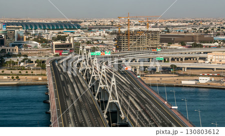 Business bay crossing bridge timelapse, 13-lane-bridge, over the Dubai Creek 130803612
