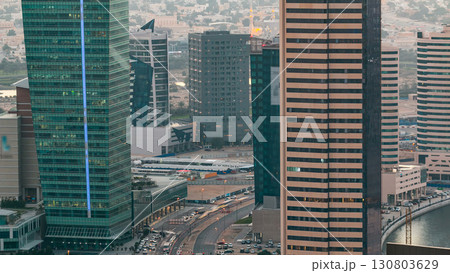 Top view of road in Dubai downtown timelapse with day traffic and business bay skyscrapers. Top view of road in Dubai downtown timelapse with day traffic and business bay skyscrapers. 130803629