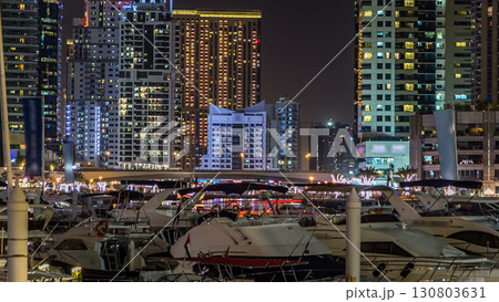 Dubai Marina towers and canal in Dubai night timelapse 130803631