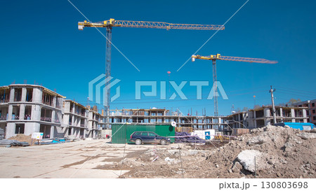 Large construction site with buildings under construction and multi-storey residential homes timelapse hyperlapse. 130803698