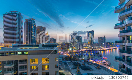An Aerial view of Dubai Marina towers in Dubai day to night timelapse 130803745
