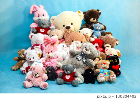 Orenburg, Russia - August 30, 2025 A pile of soft toys of different sizes on a blue background. Editorial Orenburg, Russia - August 30, 2025 A pile of soft toys of different sizes on a blue background. Editorial 130804402