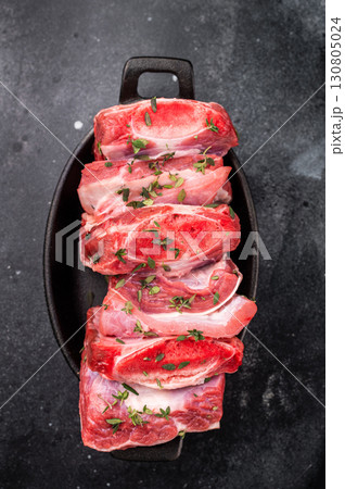 Raw Veal Short Ribs, fresh meat with thyme. black background. top view Raw Veal Short Ribs, fresh meat with thyme. black background. top view 130805024