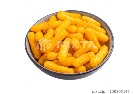 Deliciously addictive cheese flavored corn puffs, beautifully arranged on a plate. isolated on white background. top view 130805145