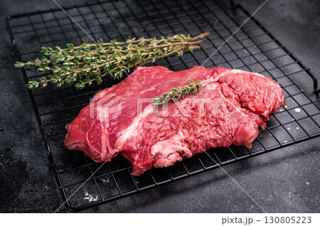 Raw hanging tender or onglet beef steak. black background. top view Raw hanging tender or onglet beef steak. black background. top view 130805223
