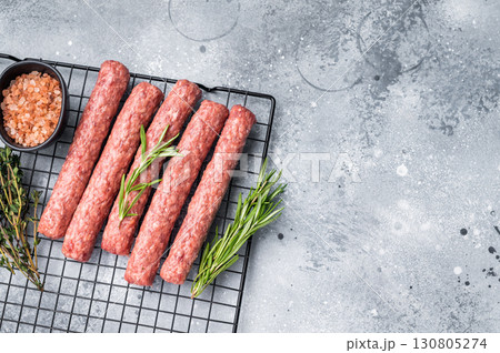 Raw beef and lamb meat kebabs sausages, kofta kebab. grey background. top view 130805274