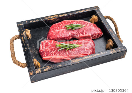 Raw Top blade steak, shoulder beef meat in wooden tray isolated on white background. top view Raw Top blade steak, shoulder beef meat in wooden tray isolated on white background. top view 130805364
