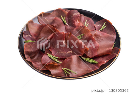 Spanish tapa Cecina meat slices, beef jamon on plate with herbs isolated on white background. top view Spanish tapa Cecina meat slices, beef jamon on plate with herbs isolated on white background. top view 130805365