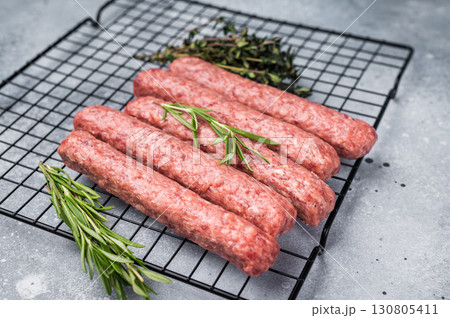 Raw beef and lamb meat kebabs sausages, kofta kebab. grey background. top view 130805411