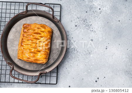 Danish pastry with a lemon jam, Puff pastry. grey background. top view 130805412