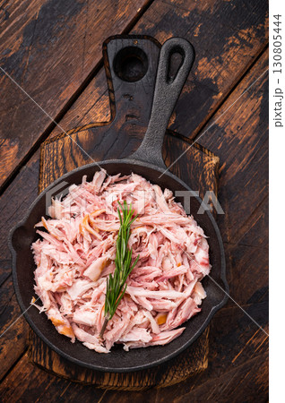 BBQ smoked Pulled Chicken meat in a skillet. wooden background. top view 130805444