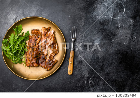 Teriyaki salmon fillet steak with salad on a plate. black background. top view Teriyaki salmon fillet steak with salad on a plate. black background. top view 130805494