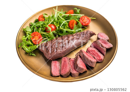 Grill Goat steak, roasted tenderloin fillet meat with salad isolated on white background. top view 130805562