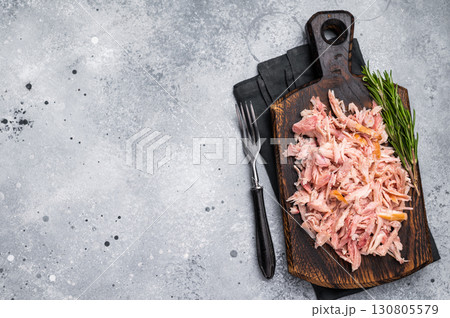 Shredded or Pulled Chicken meat on wooden board. grey background. top view 130805579
