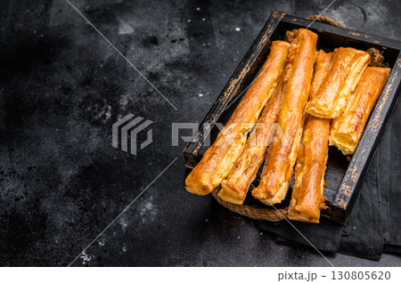 Bread sticks with cheese and salt. black background. top view 130805620