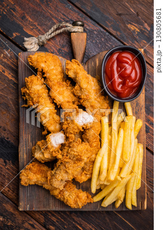 Homemade Deep Fried chicken strips, breast fillet on wooden board. wooden background. top view 130805681