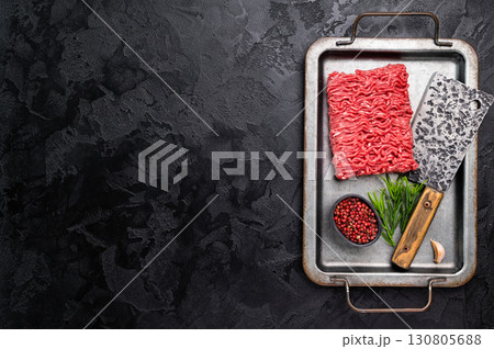 Uncooked Raw beef mince meat, forcemeat, in kitchen tray ready for cooking. 130805688