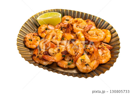 Roasted Shrimps Prawns in a metal plate isolated on white background. Roasted Shrimps Prawns in a metal plate isolated on white background. 130805733