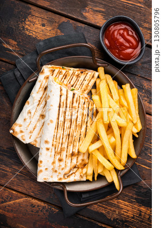 Doner kebab, Shawarma with meat, salad and french fry. wooden background. top view Doner kebab, Shawarma with meat, salad and french fry. wooden background. top view 130805796