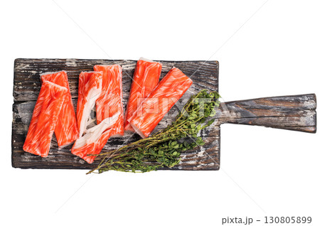 Fresh Crab sticks, crabmeat on wooden board isolated on the white background. top view 130805899
