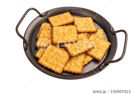 Square salty crackers in wooden tray isolated on white background, top view 130805923
