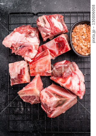Raw lamb mutton meat and bones for stew or goulash. black background. top view 130806008