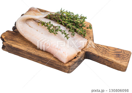 Uncooked Atlantic cod fillet, raw fish ready to be seasoned and transformed into a delicious meal. isolated on white background. top view 130806098