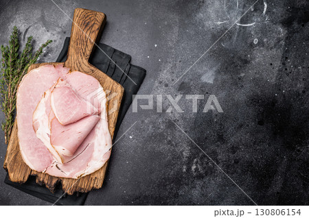 Sliced pork ham for sandwiches, smoked meat. black background. top view Sliced pork ham for sandwiches, smoked meat. black background. top view 130806154