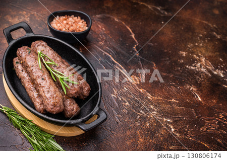 BBQ roast Turkish Urfa kebab with herbs. brown background. top view BBQ roast Turkish Urfa kebab with herbs. brown background. top view 130806174