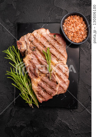 Grilled pork neck steaks. black background. top view 130806180