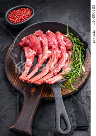 Ready for cooking Raw lamb meat chops, fresh mutton cutlets in a pan. black background. top view Ready for cooking Raw lamb meat chops, fresh mutton cutlets in a pan. black background. top view 130806182