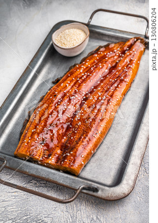 Unagi eel, grilled fish fillet with sauce. grey background. top view 130806204