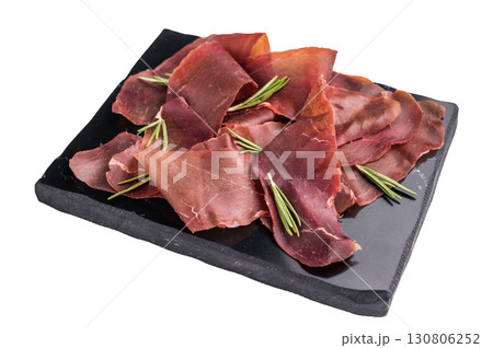 Cured cecina meat slices, spanish meat jerky isolated on white background. top view Cured cecina meat slices, spanish meat jerky isolated on white background. top view 130806252