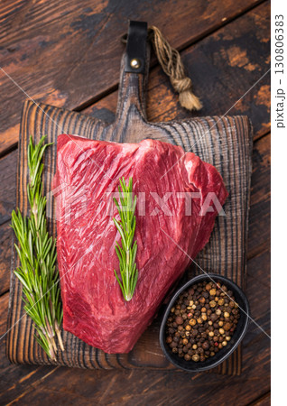 Butcher cutting board with Raw Wild Boar meat, fresh Game Meat. wooden background. top view 130806383