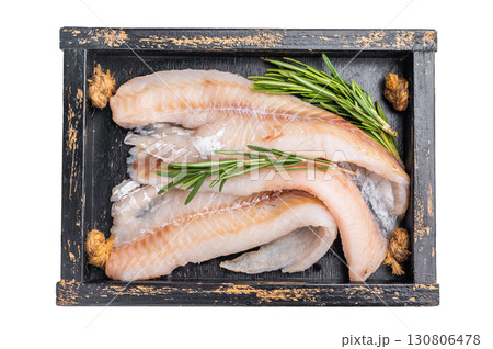 Ready for cooking Raw Hake fish fillets in a wooden tray with herbs isolated on white background. top view Ready for cooking Raw Hake fish fillets in a wooden tray with herbs isolated on white background. top view 130806478