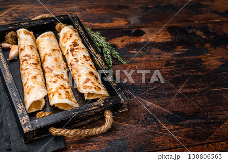 Aloo Paratha rolls, Indian Flatbread. wooden background. top view 130806563