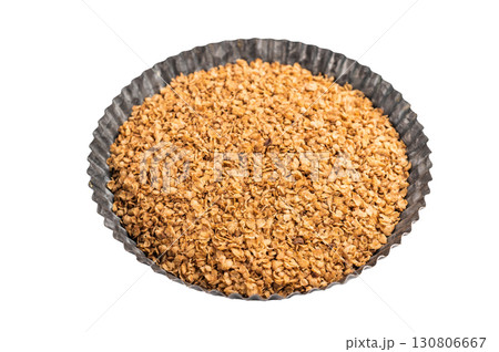 Healthy buckwheat flakes in a bowl isolated on white background. top view Healthy buckwheat flakes in a bowl isolated on white background. top view 130806667