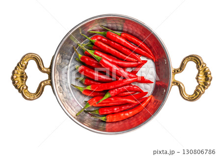 Red hot chili peppers in steel skillet isolated on white background. top view Red hot chili peppers in steel skillet isolated on white background. top view 130806786