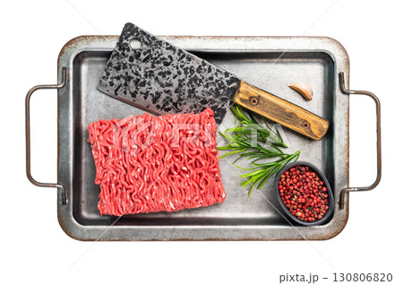 Uncooked Raw beef mince meat, forcemeat, in kitchen tray ready for cooking isolated on white background. Uncooked Raw beef mince meat, forcemeat, in kitchen tray ready for cooking isolated on white background. 130806820