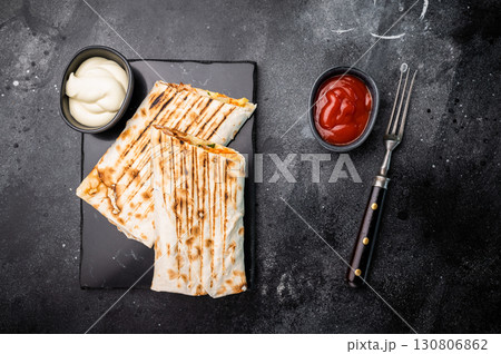 Oriental Doner kebab wrap, Shawarma with beef meat and salad. black background. top view 130806862