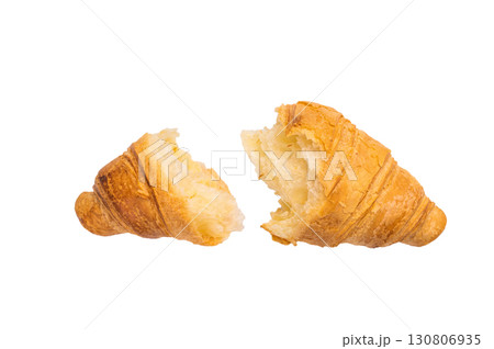 Broken French croissant isolated on white background, top view. 130806935